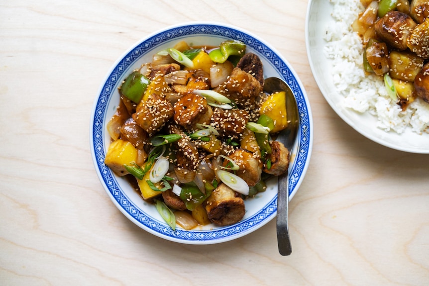 A bowl of sweet and sour eggplant, a vegetarian take on sweet and sour pork by Hetty McKinnon.