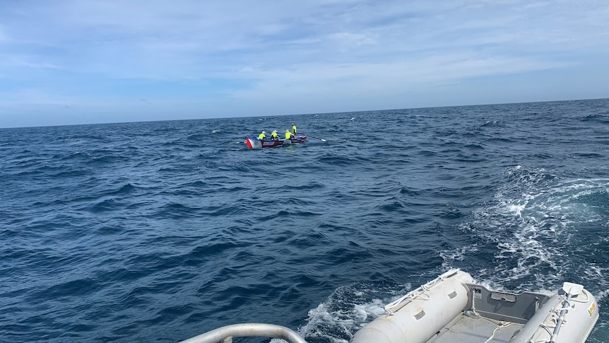 the ocean with a surf boat at sea