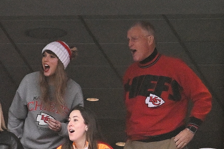 Taylor Swift, and Scott Swift cheer while watching the game at Gillette Stadium on December 17, 2023