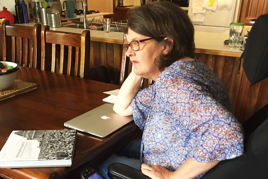 Disability campaigner Belinda Rogers at a table