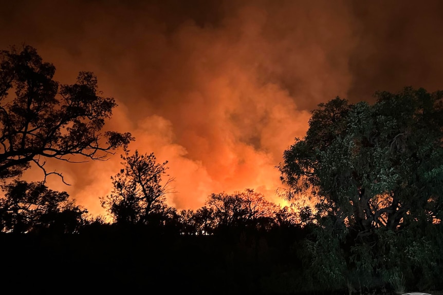 Orange smoke and flames from a bushfire in Bindoon.