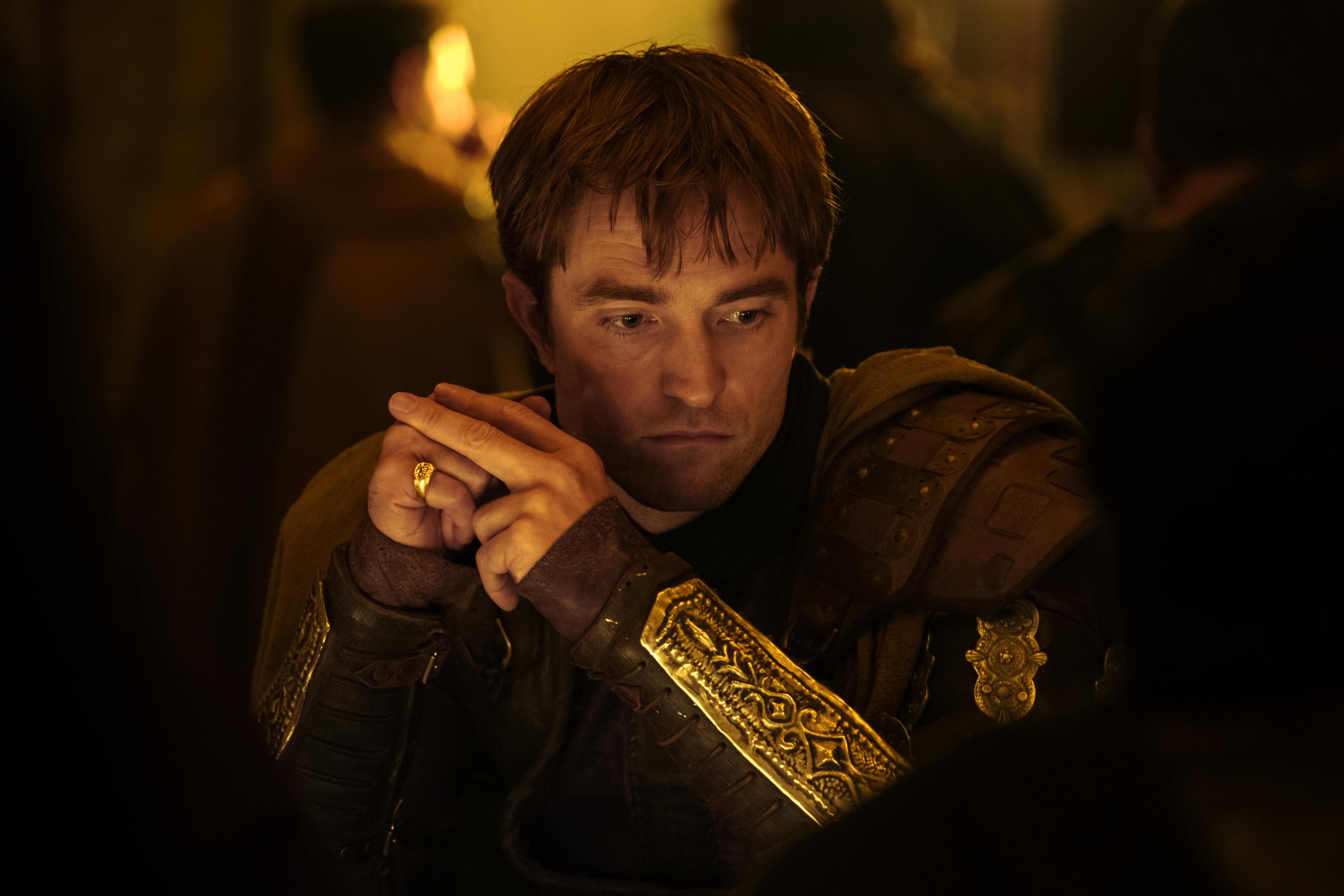 Robert Pattinson is one of the side characters offered something meatier as murderous suitor Antinous.