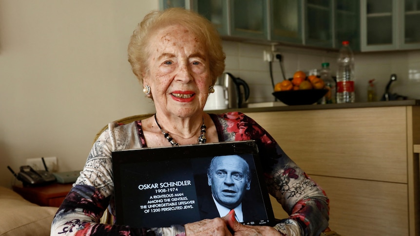 An old woman sitting and smiling