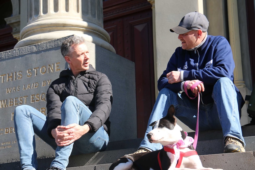 Steve Plowman sitting at Fitzroy Town Hall with Shane.