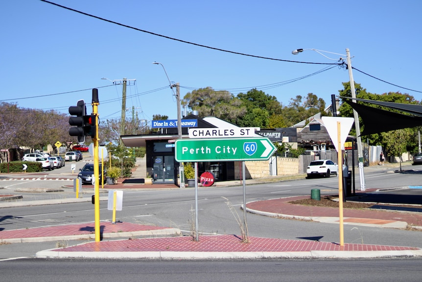 An intersection with traffic lights in suburban Perth. 