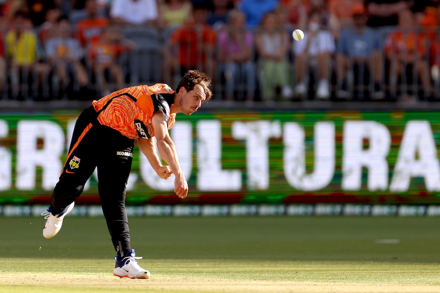 An action shot of Lance Morris bowling 