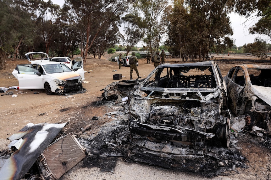 Burnt cars after Hamas gunmen murder civilians at a music festival Israel's border with Gaza in southern Israel.