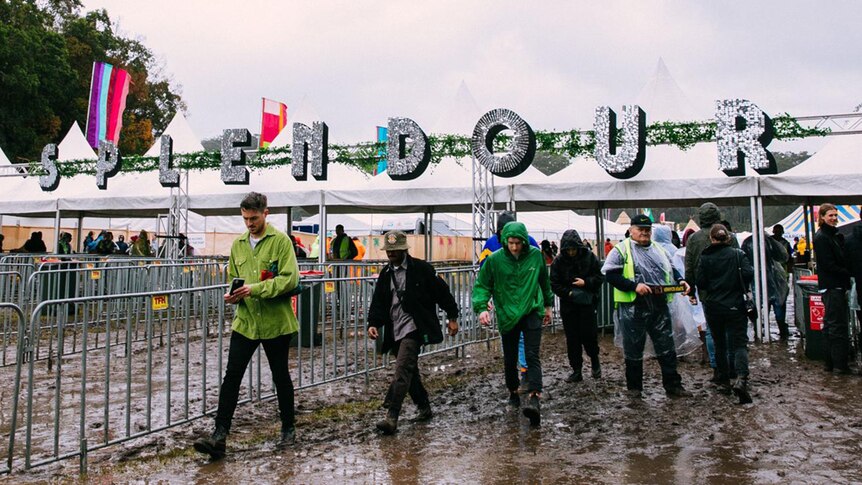 Muddy punters arriving at the gates at Splendour In The Grass