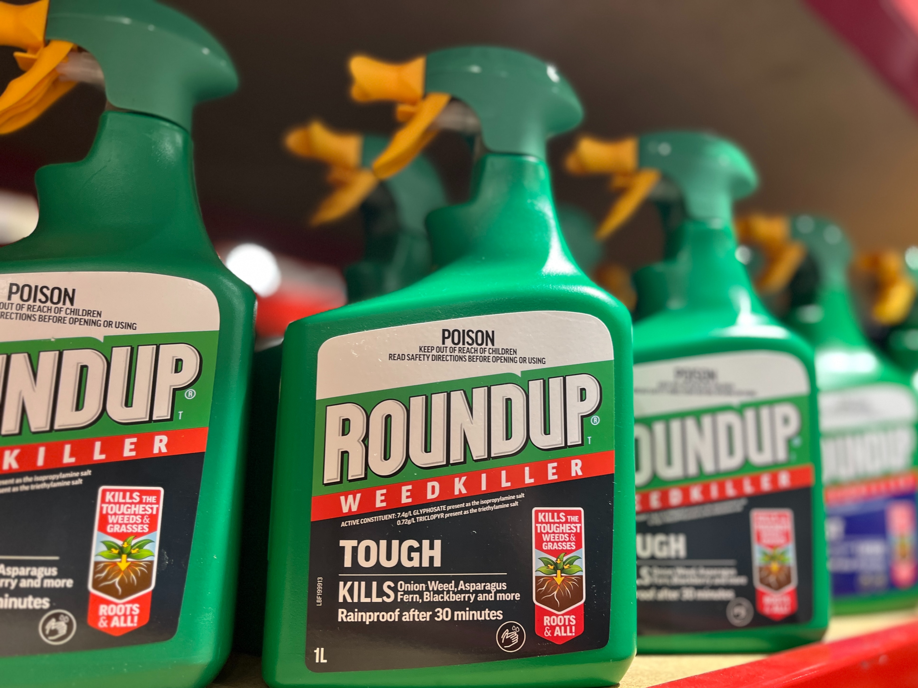 Spray bottle of Roundup on hardware store shelf