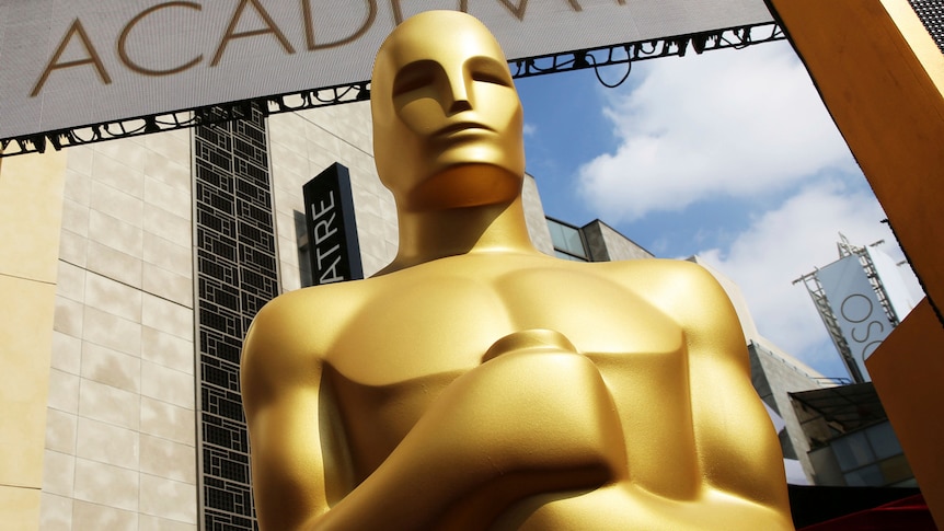 Upshot of a massive golden statue outside the Dolby Theatre in Los Angeles for the Academy Awards Ceremony