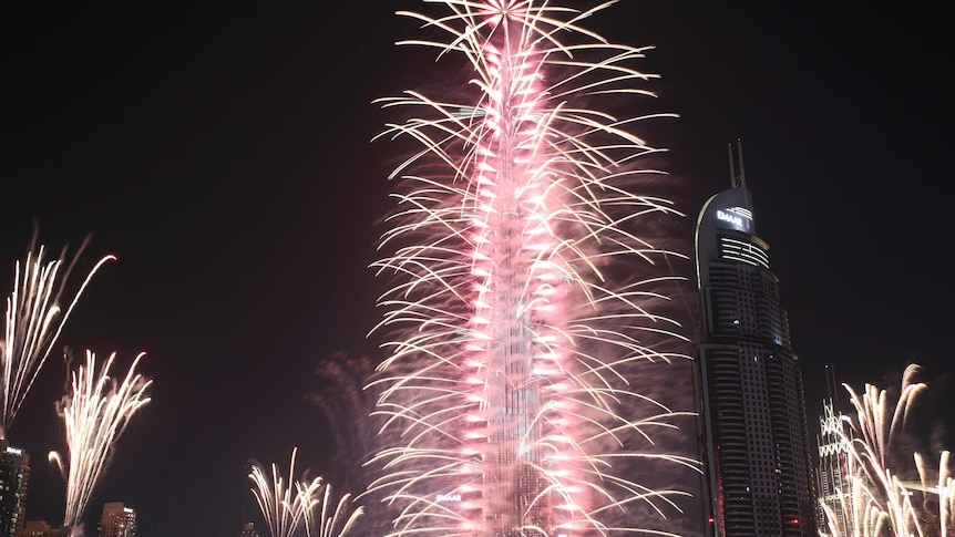 Fireworks explode at the Burj Khalifa — the world's tallest building.