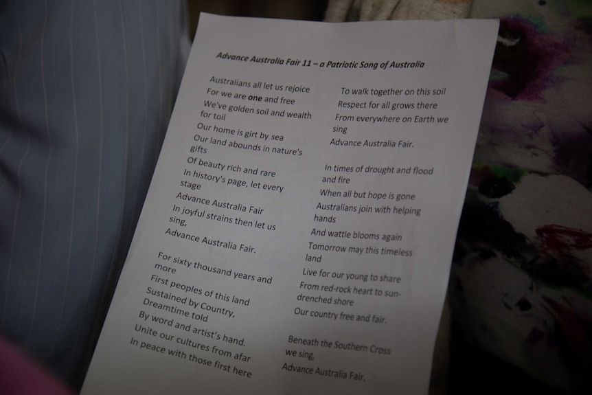 A piece of printed paper with the lyrics to a new anthem