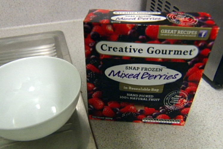 Package of Creative Gourmet frozen mixed berries beside a bowl