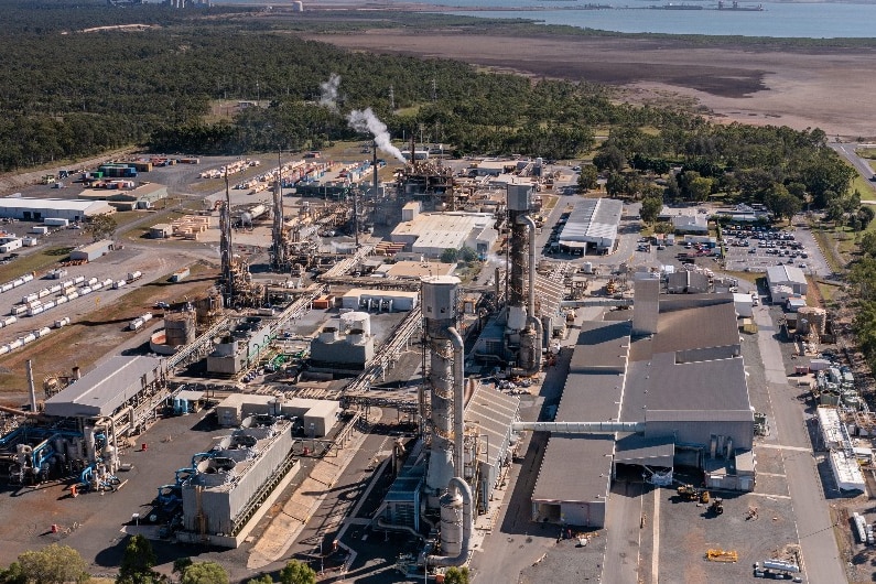 An aerial view of an industrial manufacturing facility in a regional area.