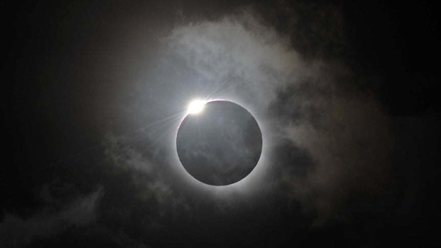 A solar eclipse at Palm Cove, in northern Queensland is shown following totality, November 14, 2012.