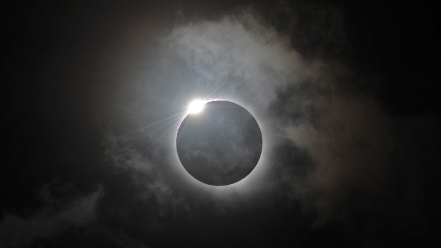 A solar eclipse at Palm Cove in north Queensland is shown following totality, November 14, 2012.