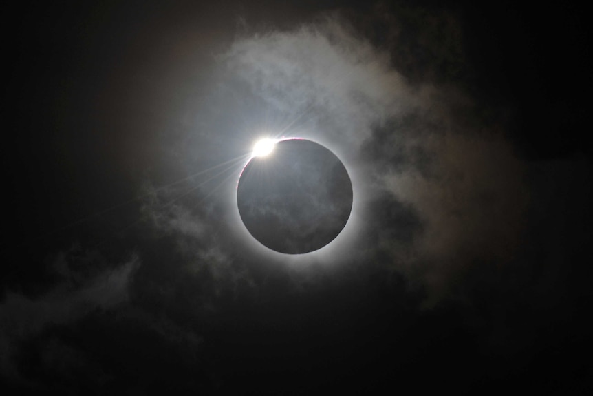 A solar eclipse at Palm Cove, in northern Queensland is shown following totality, November 14, 2012.