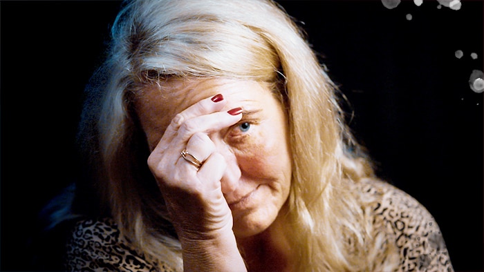 Lawyer Nicola Gobbo looks off to the side, with her hand over her face