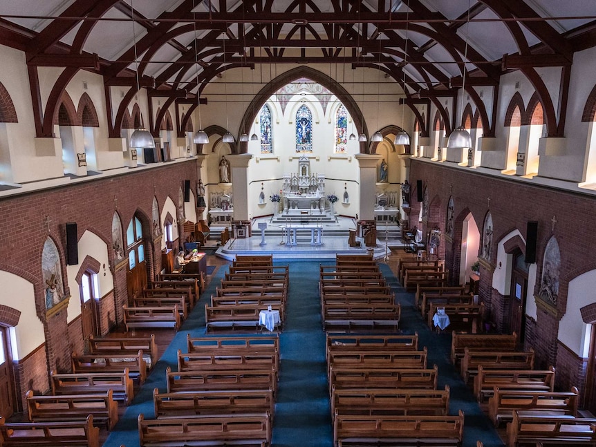 Empty rows of seats in the church