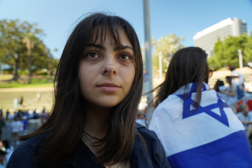 a young israeli woman at a rally in support of israel 