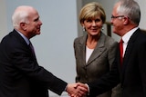US senator John McCain shakes hands with PM Malcolm Turnbull