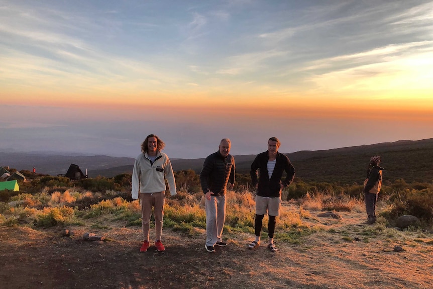 Ed Langdon and brother Tom stand on a mountain side in Tanzania.