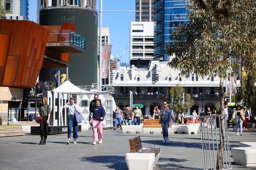 Pepole walking through Yagan Square on a sunny day.