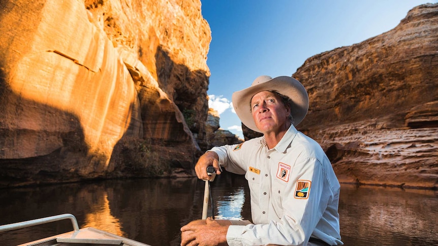 A man sits in Cobbold Gorge in the Etheridge Shire