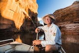 A man sits in Cobbold Gorge in the Etheridge Shire