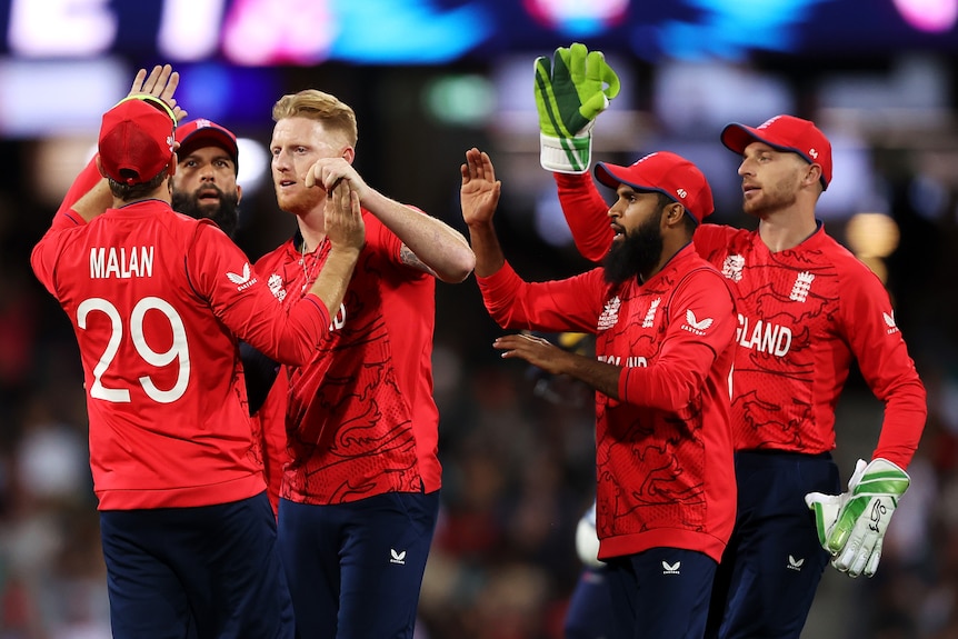 England players congratulate Ben Stokes after a wicket
