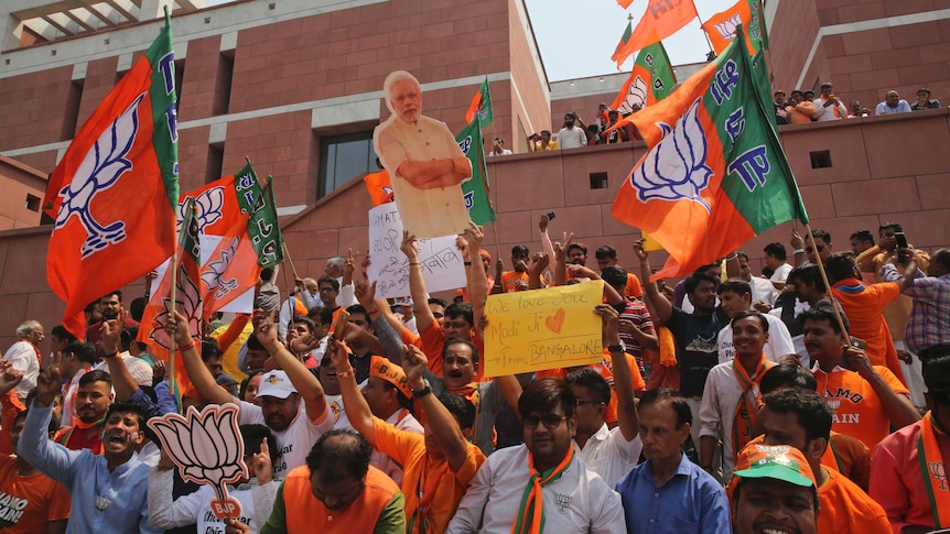 Bharatiya Janata Party (BJP) supporters celebrate their party's victory in India's elections.
