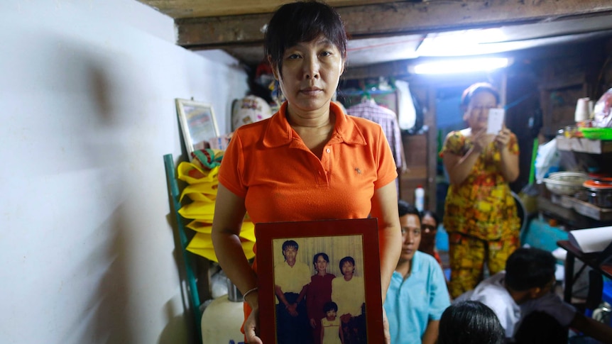 Than Dar with picture of her late husband, activist Par Gyi