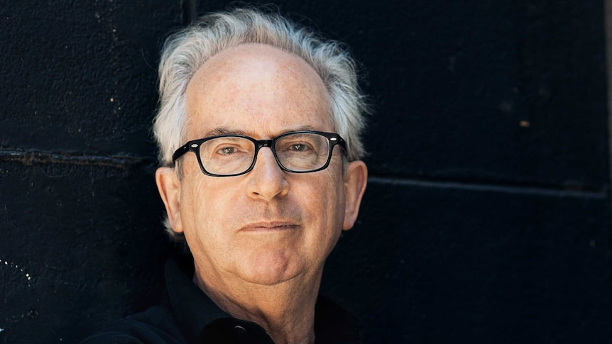 Australian author Peter Carey looks at the camera.