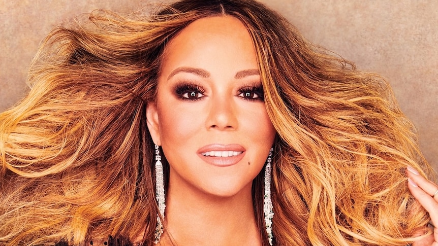 The singer Mariah Carey, hair flowing, glowing skin