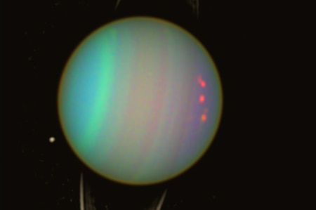 A telescope image shows Uranus's unique rotations which spin 90 degrees on the planet's side.