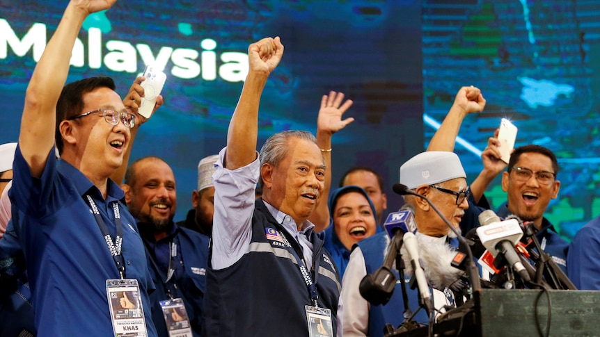 Malaysian former Prime Minister and Perikatan Nasional Chairman Muhyiddin Yassin shouts slogans with other leader.