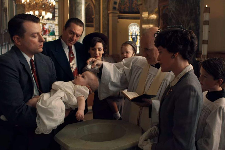 Fr James Martin, SJ, performing a baptism in the film The Irishman.