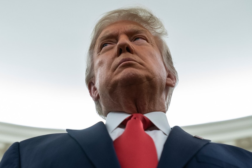 President Donald Trump listens during a ceremony to present the Presidential Medal of Freedom