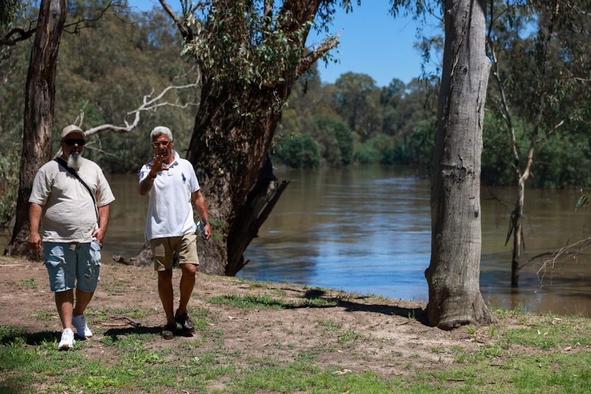 two aboriginal men looking beside the Goulburn River 