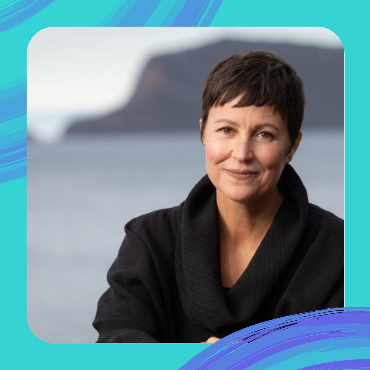 woman with short brown hair wearing black long sleeved top