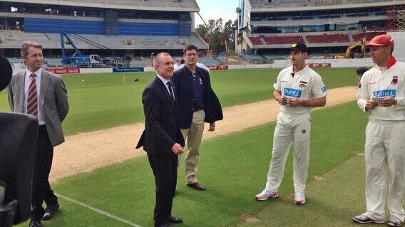 Premier Jay Weatherill tosses the coin as sport returns to Adelaide Oval, despite upgrade work not yet having been completed.