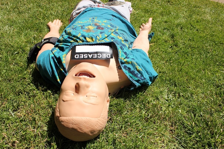 'Deceased' mannequin lies on the grass at the emergency planning event in Ballarat