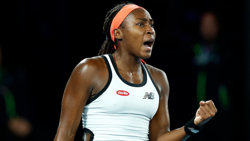 An American female profressional tennis player pumps her left fist during a match at the Australian Open.