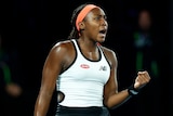 An American female profressional tennis player pumps her left fist during a match at the Australian Open.