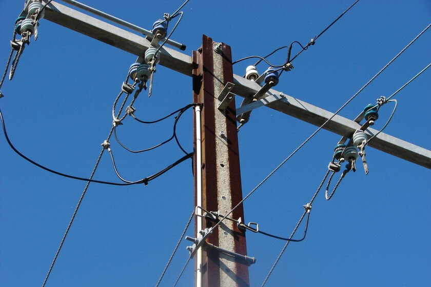 Overhead wires on a power pole, known in Adelaide as a stobie pole, named after its inventor.
