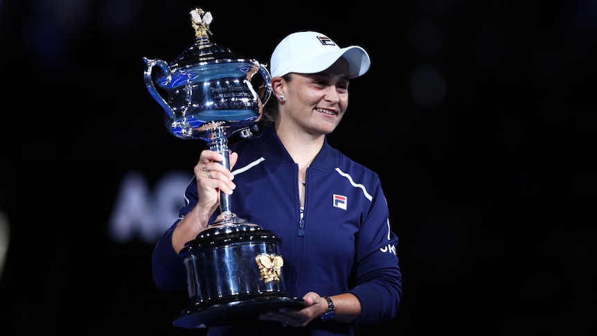 Ash Barty holds up the Australian Open trophy