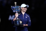 Ash Barty holds up the Australian Open trophy