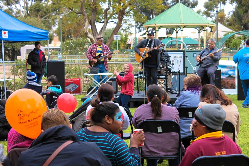 Phil Kickett performs at Broken Hill's NAIDOC Week family fun day.