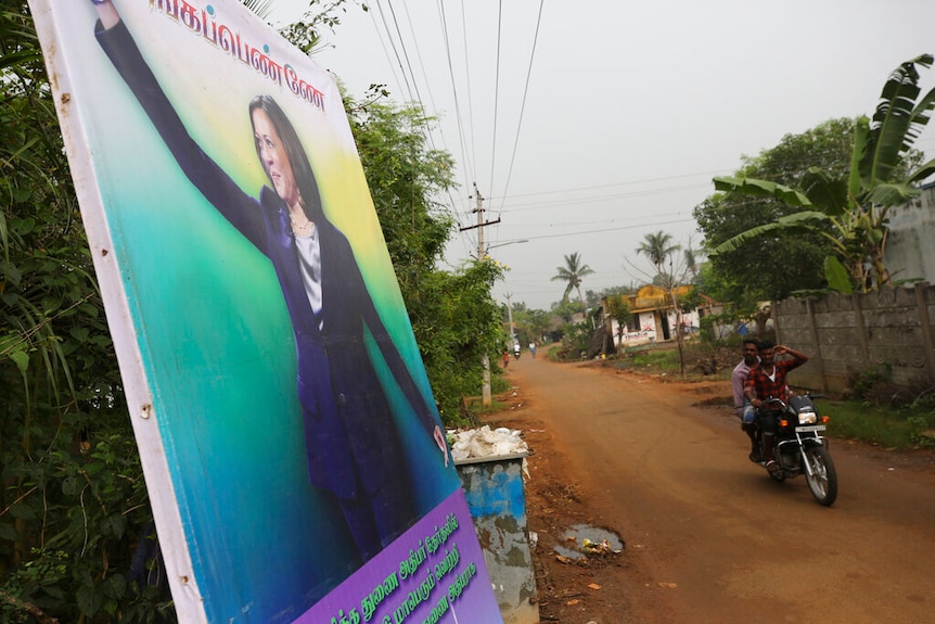 A banner featuring U.S. Vice President-elect Kamala Harris with a message wishing her the best is displayed in Thulasendrapuram.
