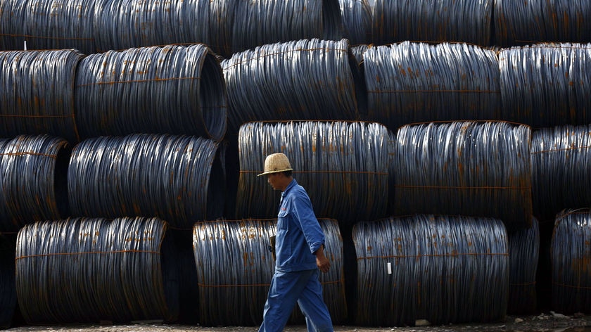 Worker at a steel mill, China